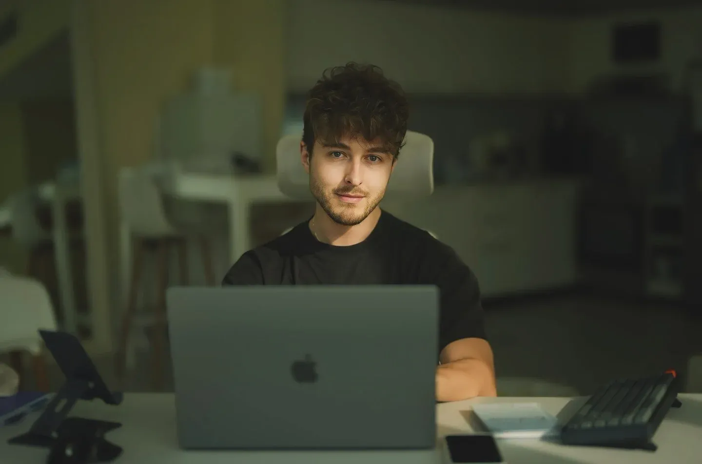 Joel working late at his desk in Dubai